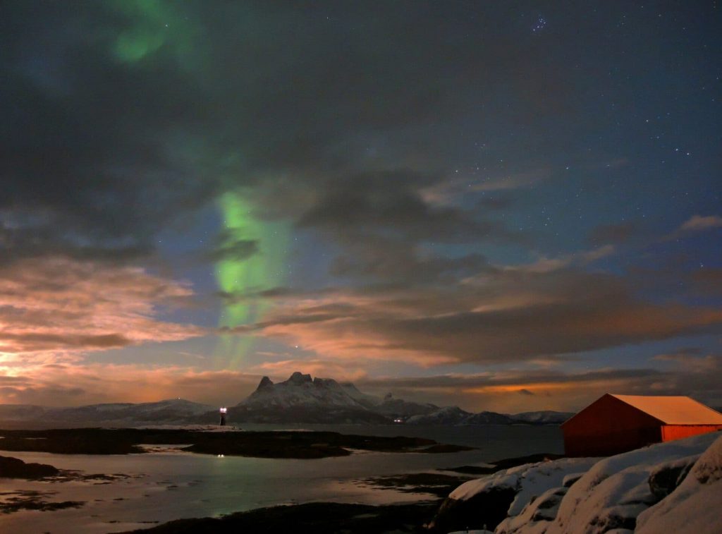 polar lighthouse under the aurora borealis