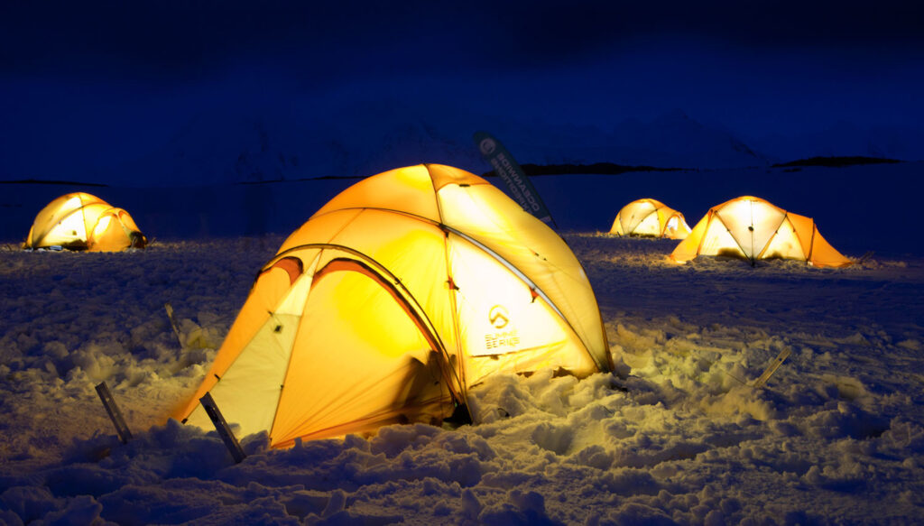 Camping tents on antarctica at night