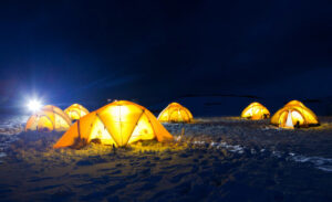 night view of camping tents