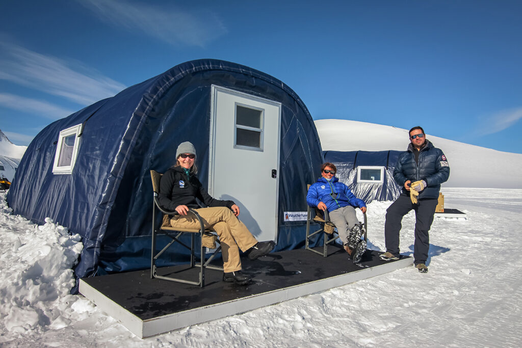 Enjoying the views and sunshine from the front deck of the guest sleeping tents at Three Glaciers Camp.